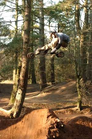 Mountain boarder Tom Kirkman takes off